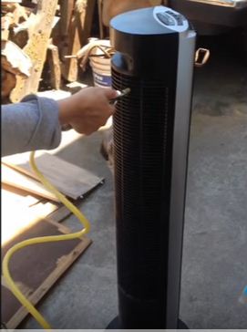 How to Clean a tower fan using a hose on a heater.