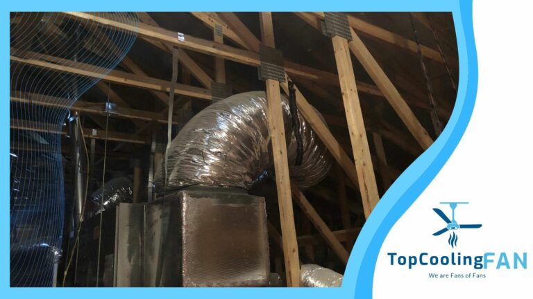 A room with a ceiling fan and ducts in it, ideal for adjusting attic fan temperature.